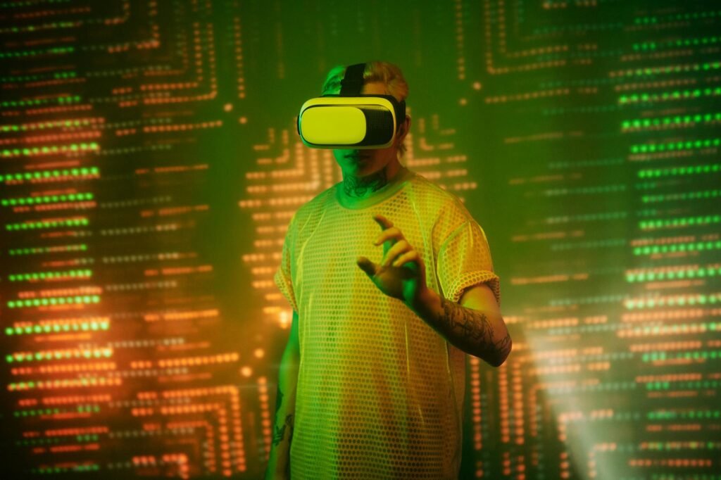 man in yellow shirt wearing white and black vr goggles